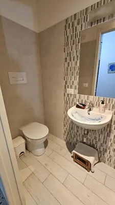 a bathroom with a toilet and a sink at Le Terrazze in Carini