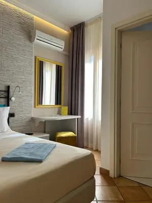 a hotel room with a bed and a sink at Hotel Trinacria in San Vito lo Capo
