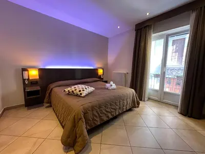 a bedroom with a bed with a purple ceiling at BB 10 Serpotta - Palazzo Riolo & Restaurant in Palermo