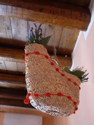 a woven basket hanging from a ceiling at A Vanedda in Termini Imerese