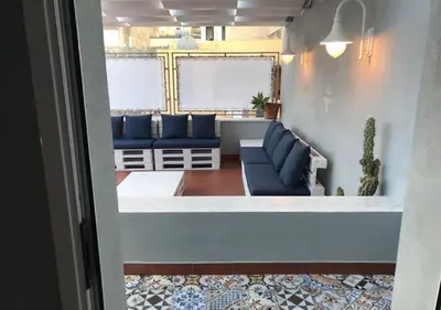 a view of a living room with blue couches at NA' SCICCHERIA HOME in Castellammare del Golfo