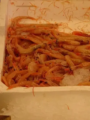 a box filled with carrots and onions at Around Cassaro Holiday House in Palermo
