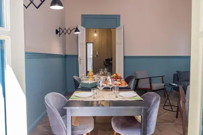a dining room with a table and chairs at Al teatro Massimo in Palermo