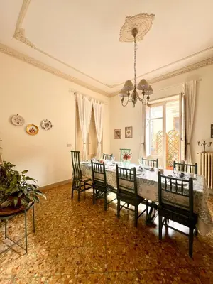 a dining room with a table and chairs at Casa Jolanda B&B in Palermo