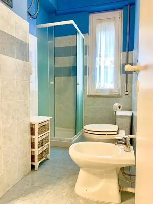 a bathroom with a toilet and a shower and a sink at Appartamento al centro vicino il porto in Palermo