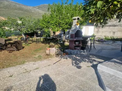 a shadow of a person standing in front of a fire hydrant at Casa turiddu Makari in Castelluzzo