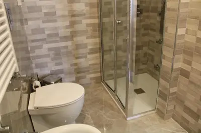 a bathroom with a toilet and a shower at B&B D'Amari Affittacamere in Palermo