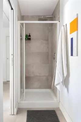 a bathroom with a shower with a glass door at Casa Madonia in Terrasini