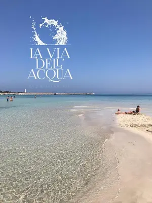 a beach with the words la vida del acuola on it at La Via dell'Acqua in Macari