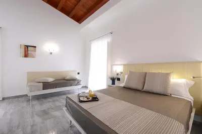 a bedroom with a large bed with a tray on it at Best Western Hotel Principe di Lampedusa in Palermo