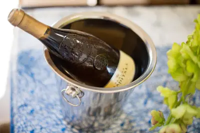 a bottle of wine is sitting in a bucket at Casa vacanze Mare Nostrum in Castellammare del Golfo