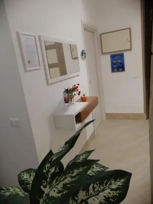 a bathroom with a sink and a potted plant at I Paesaggi in Castellammare del Golfo