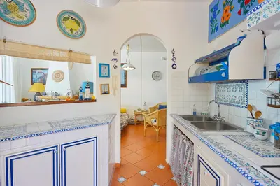 a kitchen with a sink and a counter top at Villa Gabry in Bagheria