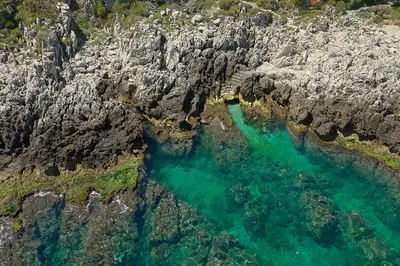 an aerial view of a body of water between rocks at Villa Gabry in Bagheria