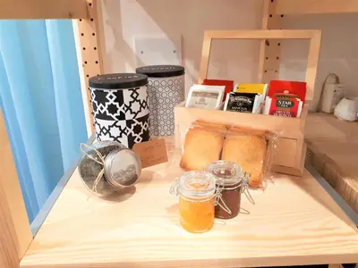 a wooden shelf with some food and drinks on it at Palermo Home White Home in Palermo