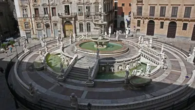 a large fountain in front of a building at Virginia House in Palermo