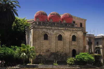 an old building with red domes on top of it at Al Civico 8 - Palermo in Palermo