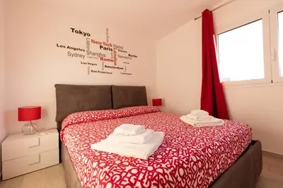 a bedroom with a bed with two towels on it at Villa Cristina - Relax - Piscina e Vista Mare in Castellammare del Golfo