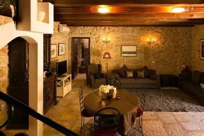 a living room with a couch and a table at Borgo degli Angeli Wellness & Resort by Le Dhome Sicily in Balestrate