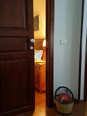 an open door with a basket in a room at Casa Vacanze Villa D'Orleans in Palermo