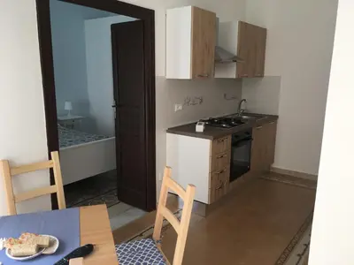 a small kitchen with a sink and a stove at Casa Vacanze Mannina in Castellammare del Golfo