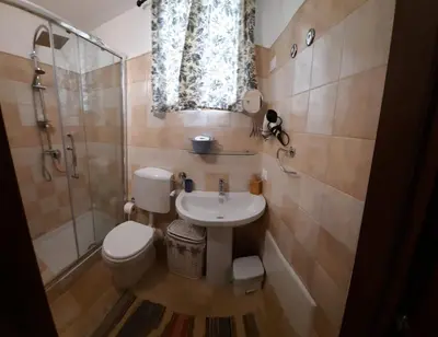 a bathroom with a toilet and a sink and a shower at Guest House Beati Paoli in Palermo