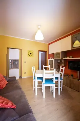 a kitchen and dining room with a table and chairs at Caleidoscopica Bahlara Ballarò in Palermo