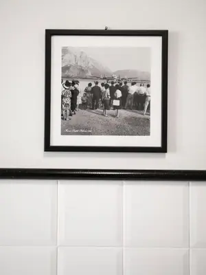 a framed picture of a group of people on a beach at Casa d'arte Ugdulena con Piscina e Terrazza by Wonderful Italy in Palermo