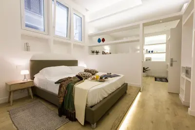 a bedroom with a large bed in a room at Palermo In Suite Aparthotel in Palermo