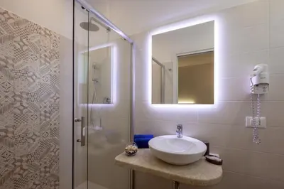 a bathroom with a sink and a shower at Affittacamere Sirius in San Vito lo Capo