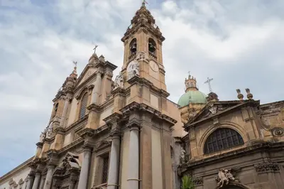 a building with a clock tower on top of it at Casa Salinas Centro Storico in Palermo