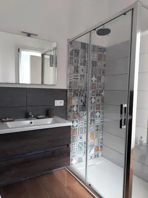 a bathroom with a shower and a sink at Granatelli Holiday Home in Altavilla Milicia