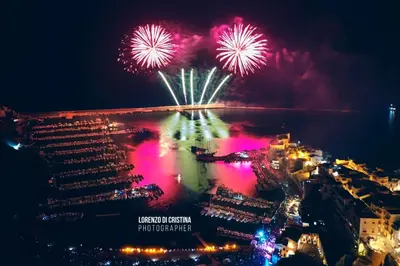 an aerial view of fireworks over the water at DE MEO Guest House in Castellammare del Golfo