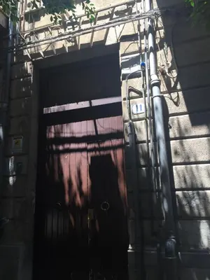 a garage door with a iron gate on a building at CLUVERIO11 LUXURY APARTMENT in Palermo