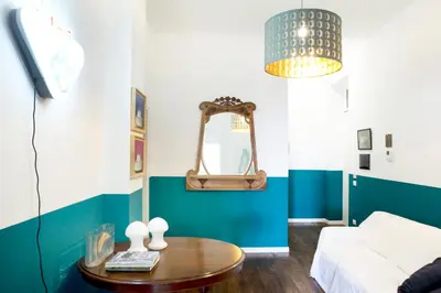 a living room with a couch and a table at 90100 in Palermo