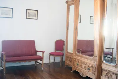 a room with two chairs and a mirror at 90100 in Palermo