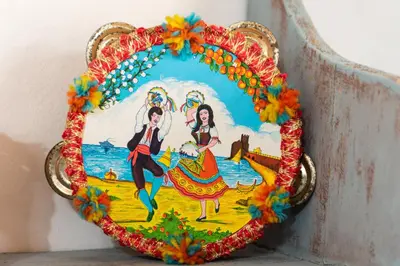 a plate with a painting of two women on a horse at L' Arena Suite - Sicilian style 140 mq flat with balcony and Arena seeview in Castellammare del Golfo