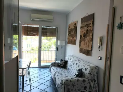 a living room with a couch and a table at Casa Maro' in Palermo