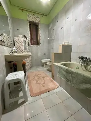 a bathroom with a sink and a tub and a toilet at Big Mom House in Palermo