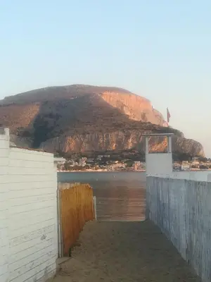 a view from the side of a building with a mountain at La stanza di Angi a Mondello in Palermo