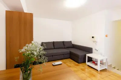 a living room with a couch and a table at GuestHost - Palermo Functional Studio in Palermo