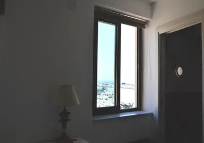 a room with a window with a lamp and a lampost at Case Vacanza Calamaro in Trabia