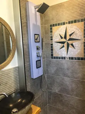 a bathroom with a sink and a star on the wall at Case Vacanza Calamaro in Trabia