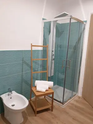 a bathroom with a shower and a toilet and a sink at B&B Matteo Bonello - Fianco Cattedrale in Palermo
