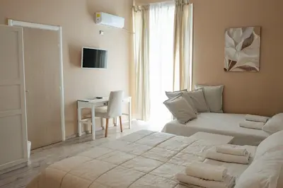 a bedroom with a bed and a desk in it at B&B Matteo Bonello - Fianco Cattedrale in Palermo