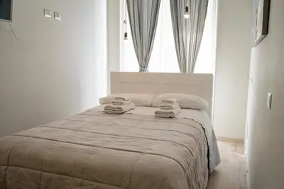 a bedroom with a bed with two towels on it at B&B Matteo Bonello - Fianco Cattedrale in Palermo