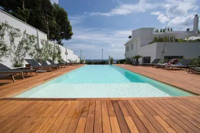 a swimming pool on the roof of a building at Unìco Boutique Hotel d'Arte in Mondello