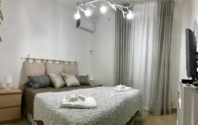 a bedroom with a bed with two towels on it at Cappuccini Green Relax in Carini
