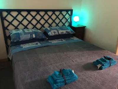 a bedroom with a bed with two towels on it at Al Baglio low cost in Palermo