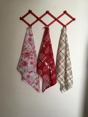 three ties hanging on a rack on a wall at Al Baglio low cost in Palermo